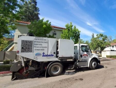 Street cleaning truck on residential street